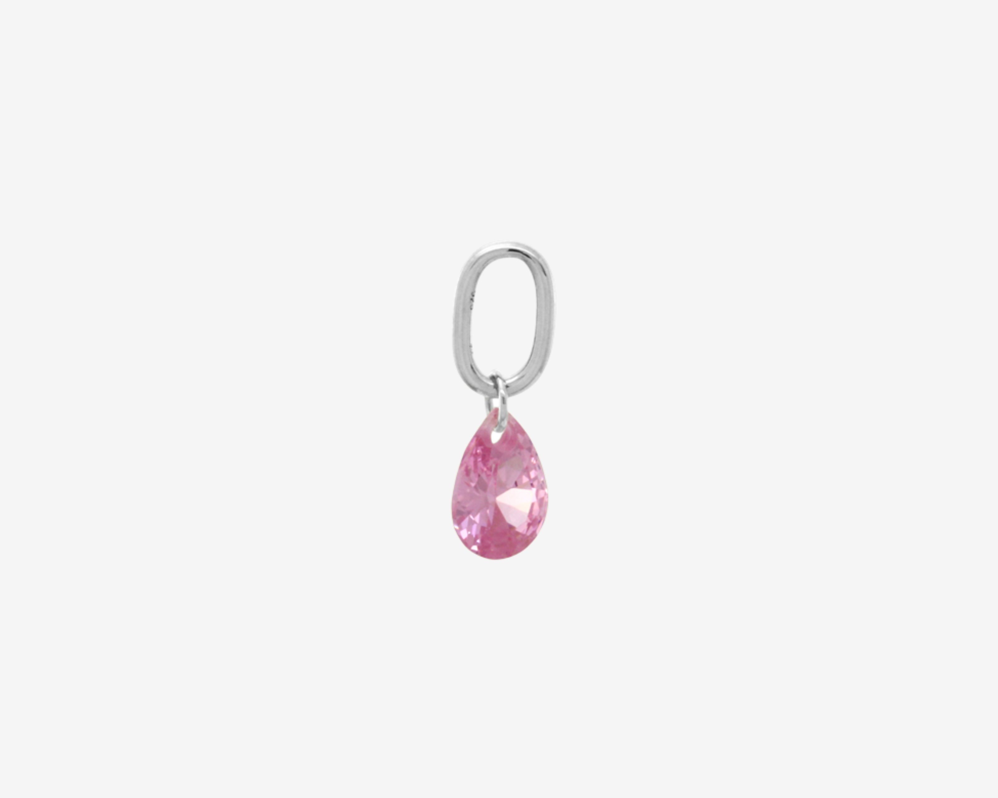 Şener Besim Teardrop Charm with pink rose quartz cubic zirconia in rhodium plating, flat lay