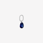 Şener Besim Teardrop Charm with sapphire cubic zirconia in rhodium plating, flat lay