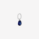 Şener Besim Teardrop Charm with sapphire cubic zirconia in rhodium plating, flat lay