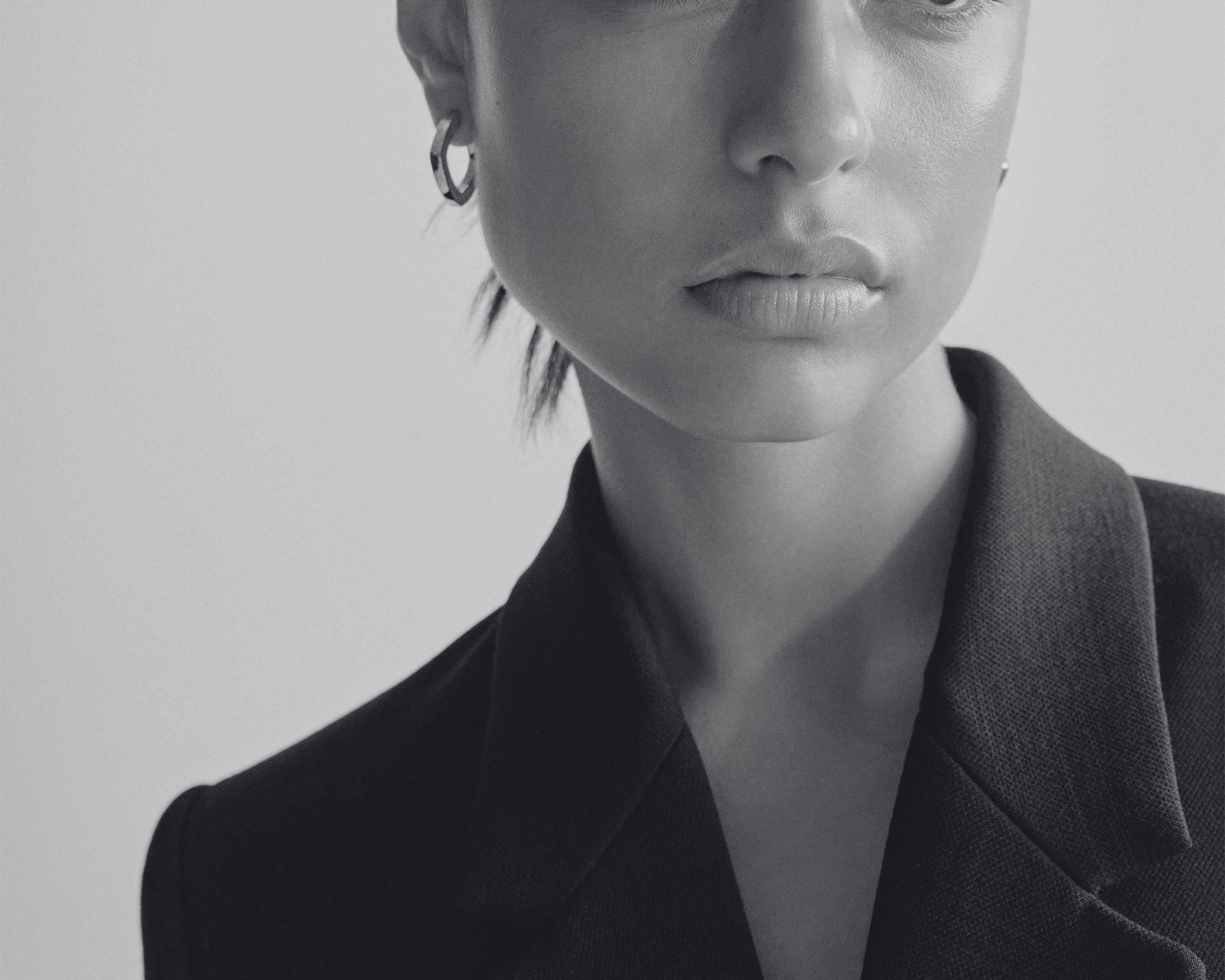 sener besim thick statement earrings on model
