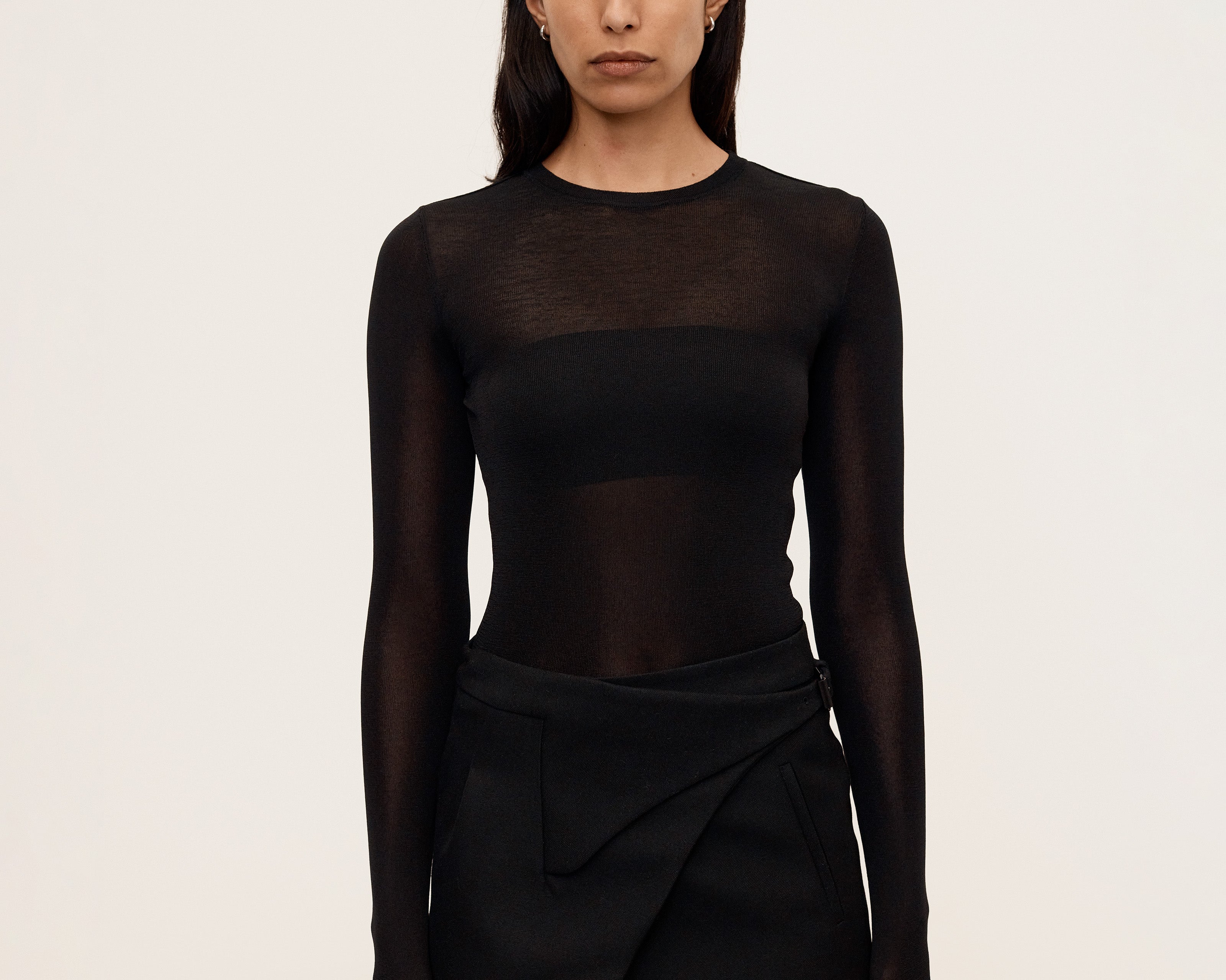 Black semi-sheer long sleeve crewneck top with thumbhole detail, front view — Şener Besim