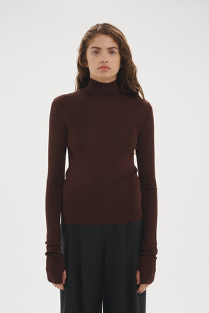 Şener Besim Thumbhole Turtleneck in Chocolate worn close-fitted, front view