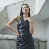 Black vegan leather halter neck mini dress with ruched detail — Şener Besim