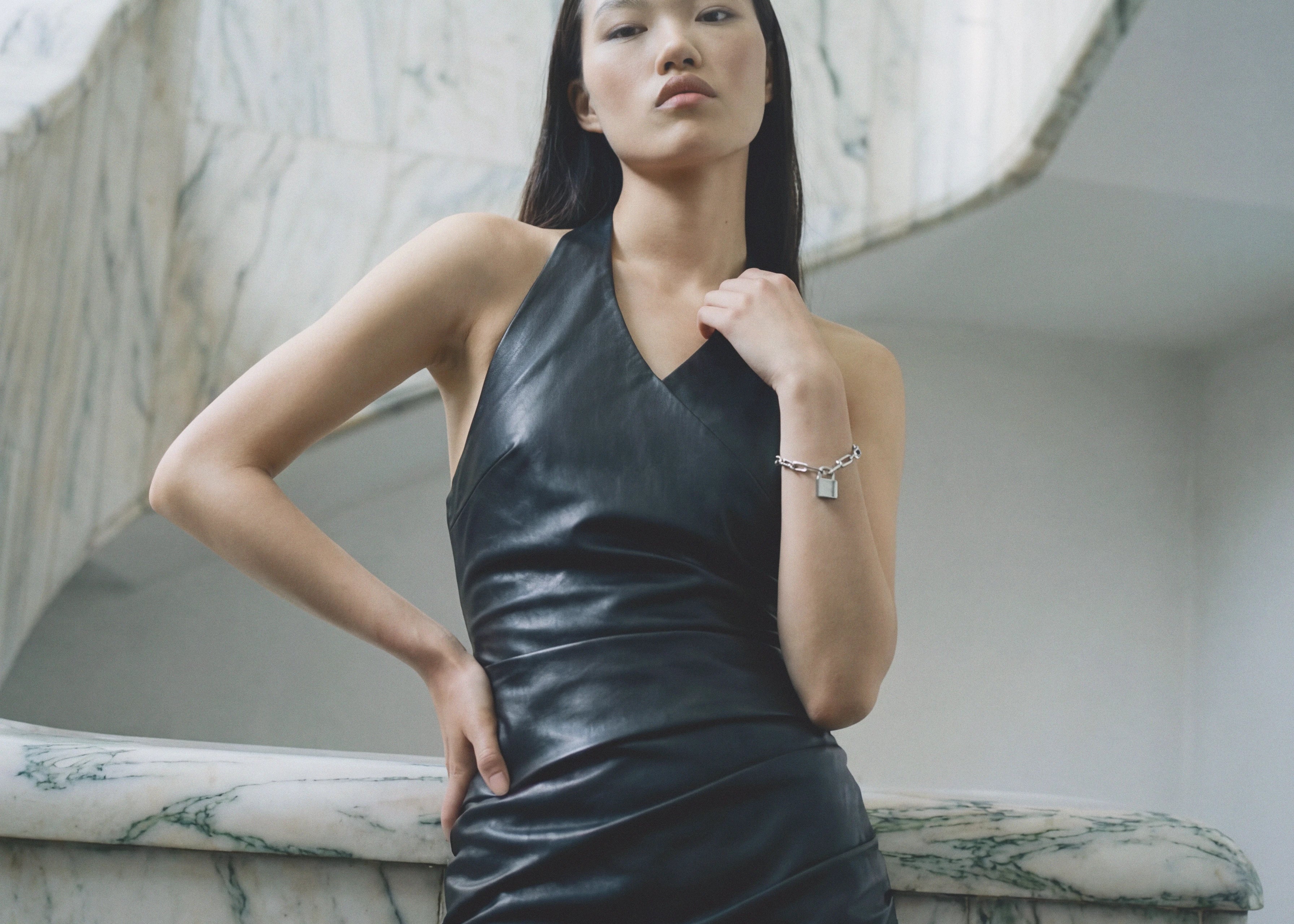 Black vegan leather halter neck mini dress with ruched detail — Şener Besim