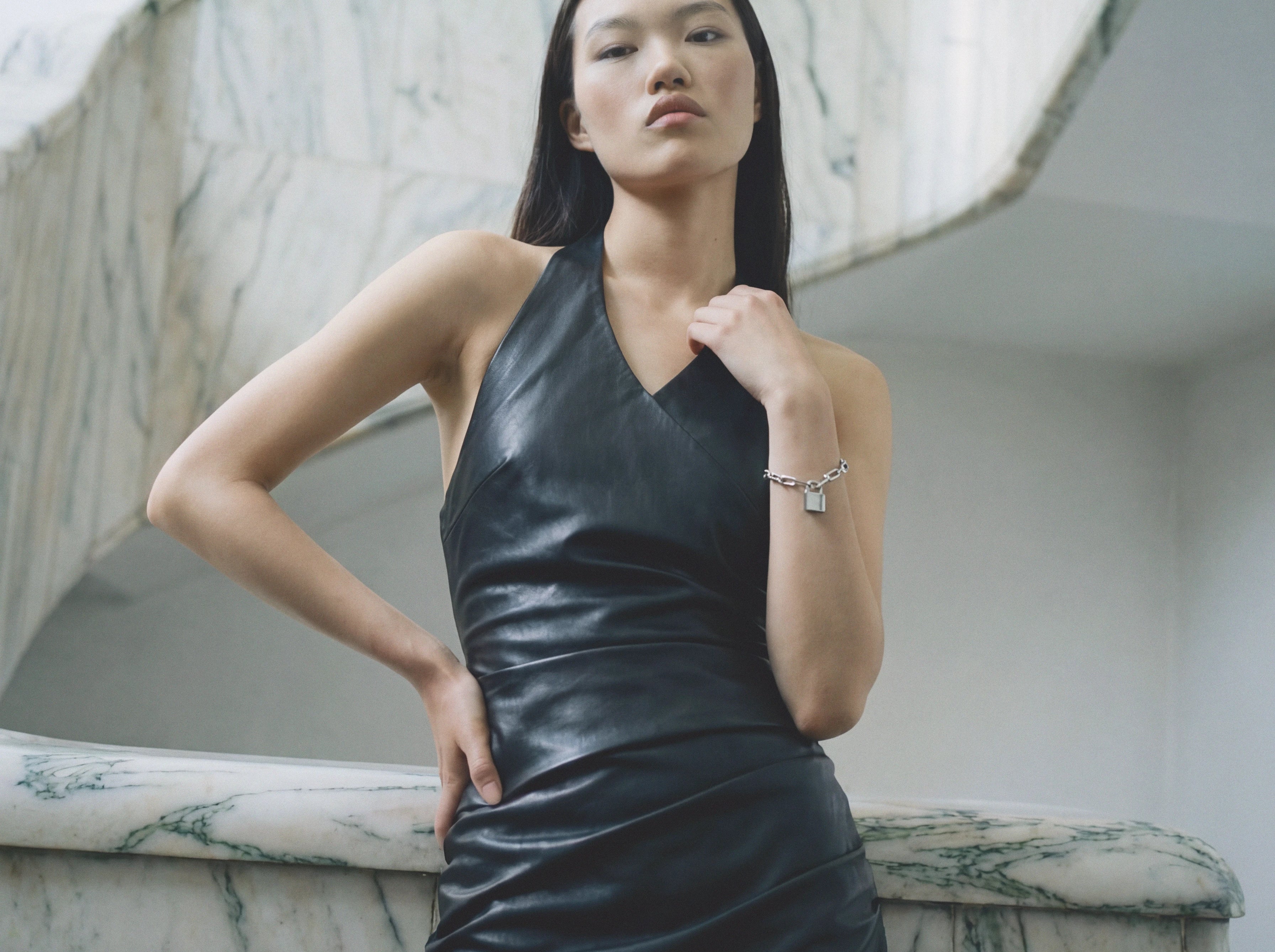 Black vegan leather halter neck mini dress with ruched detail — Şener Besim