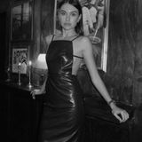 sener besim vegan leather apron dress worn by model 