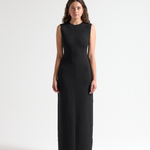 model wearing a black sleeveless long dress by sener besim