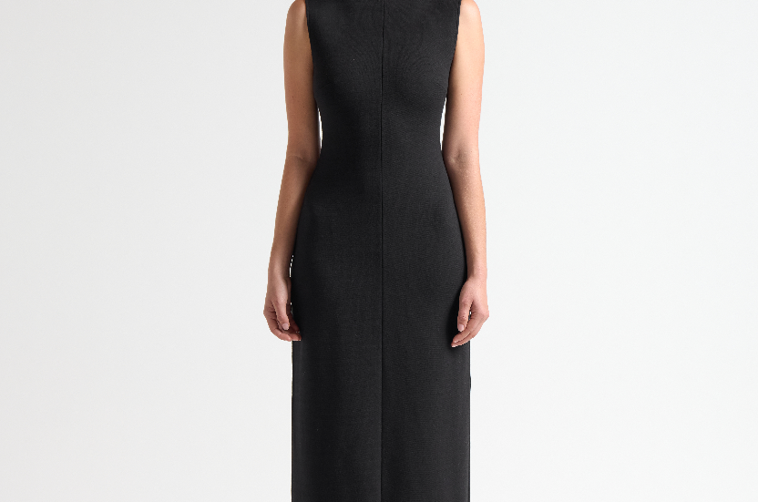model wearing a black sleeveless long dress by sener besim