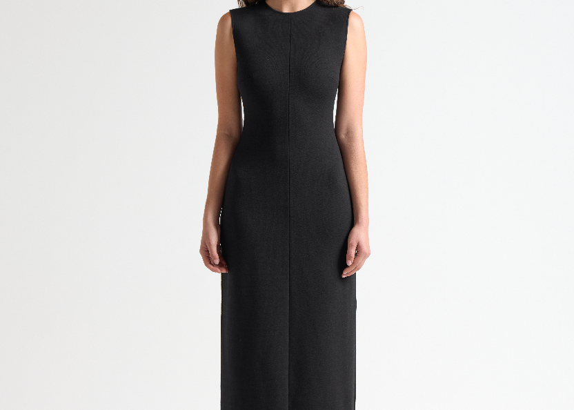 model wearing a black sleeveless long dress by sener besim