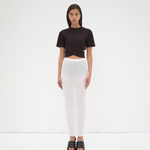 A model wearing a black cropped wrap tee by sener besim