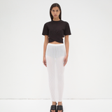 A model wearing a black cropped wrap tee by sener besim