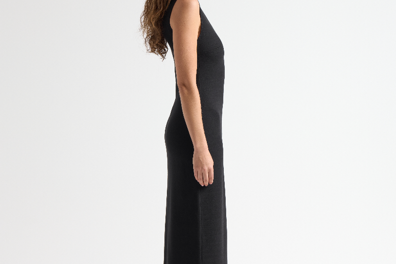 side view of model wearing sener besim long sleeveless simple dress