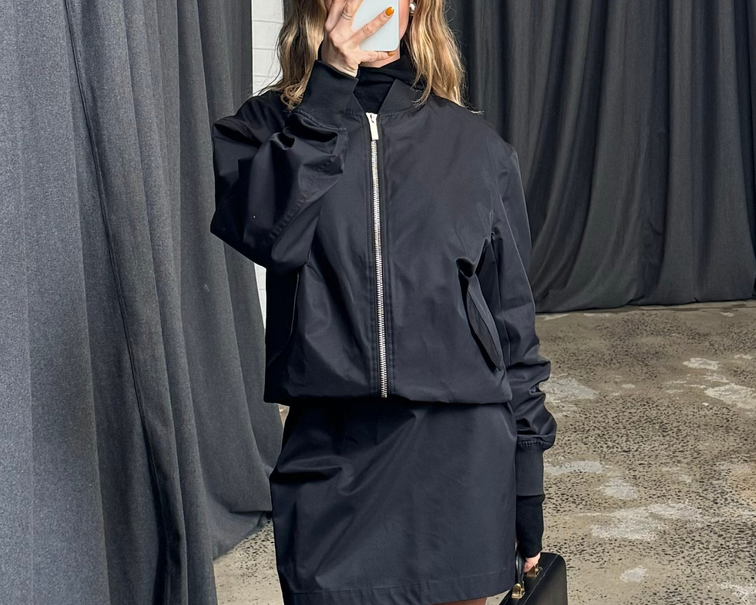 paris wycherley wearing the mini pencil skirt in black by sener besim