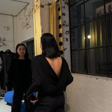 model wearing relaxed boxy shirt by sener besim with open back