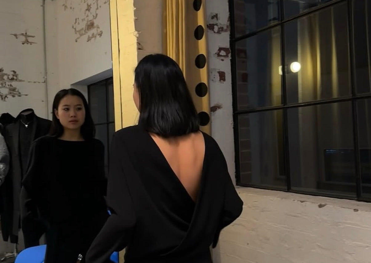 model wearing relaxed boxy shirt by sener besim with open back