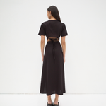 back view of model wearing sener besim crop T-shirt with tie up back