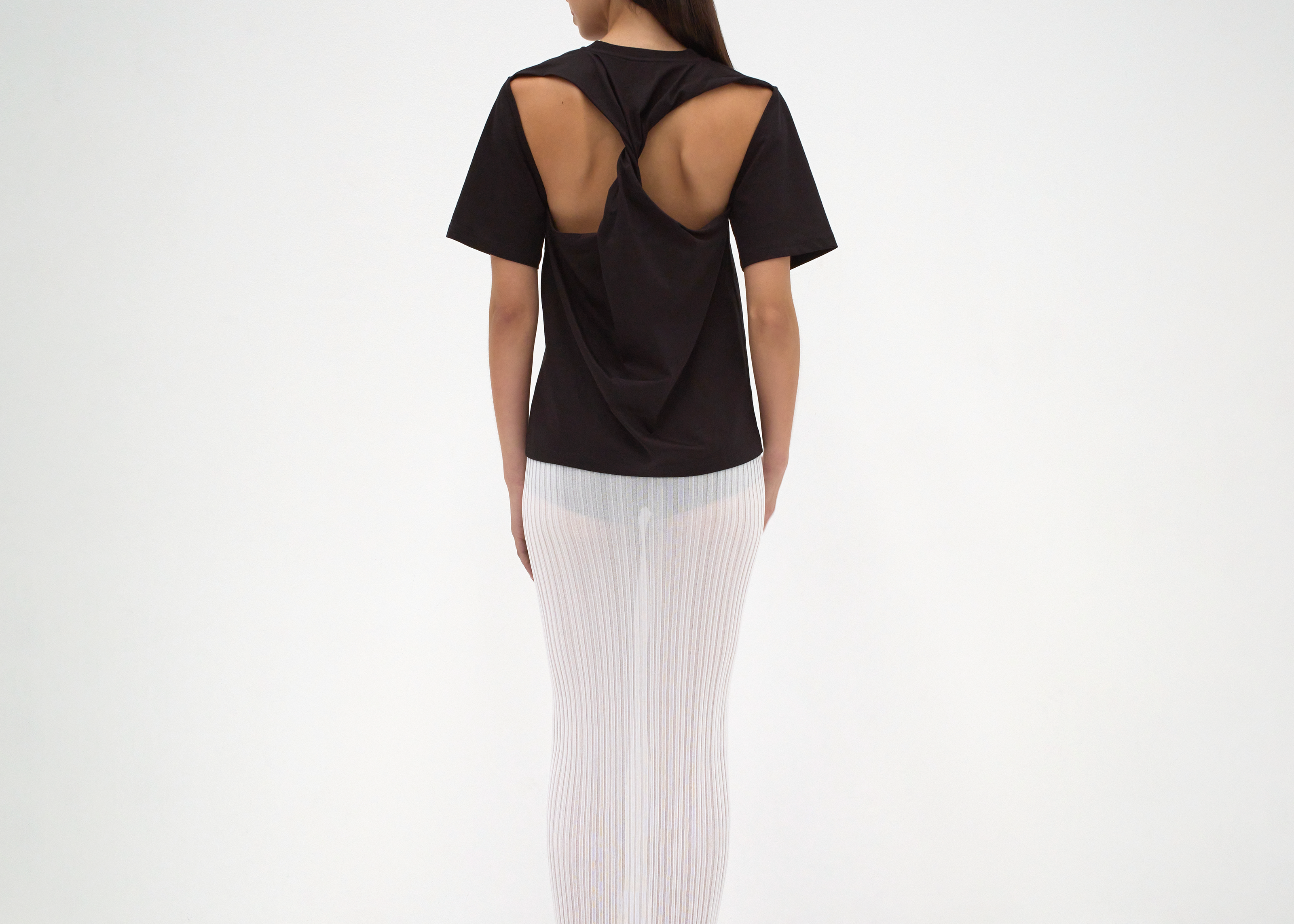 sener besim twist back tee on model with cut out detail