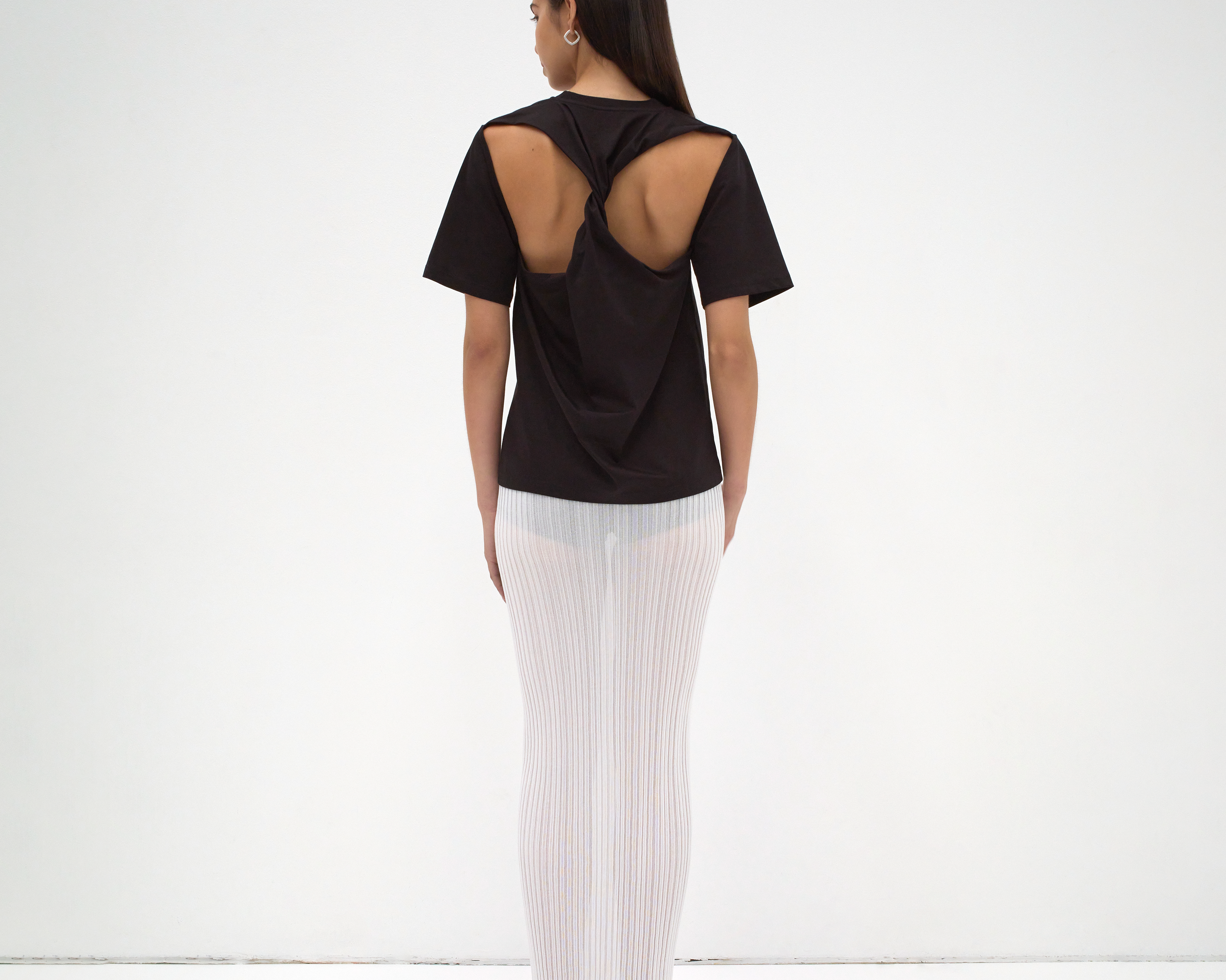 sener besim twist back tee on model with cut out detail