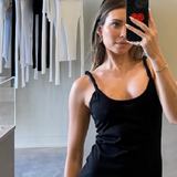 influencer model wearing sener besim twisted strap dress in store