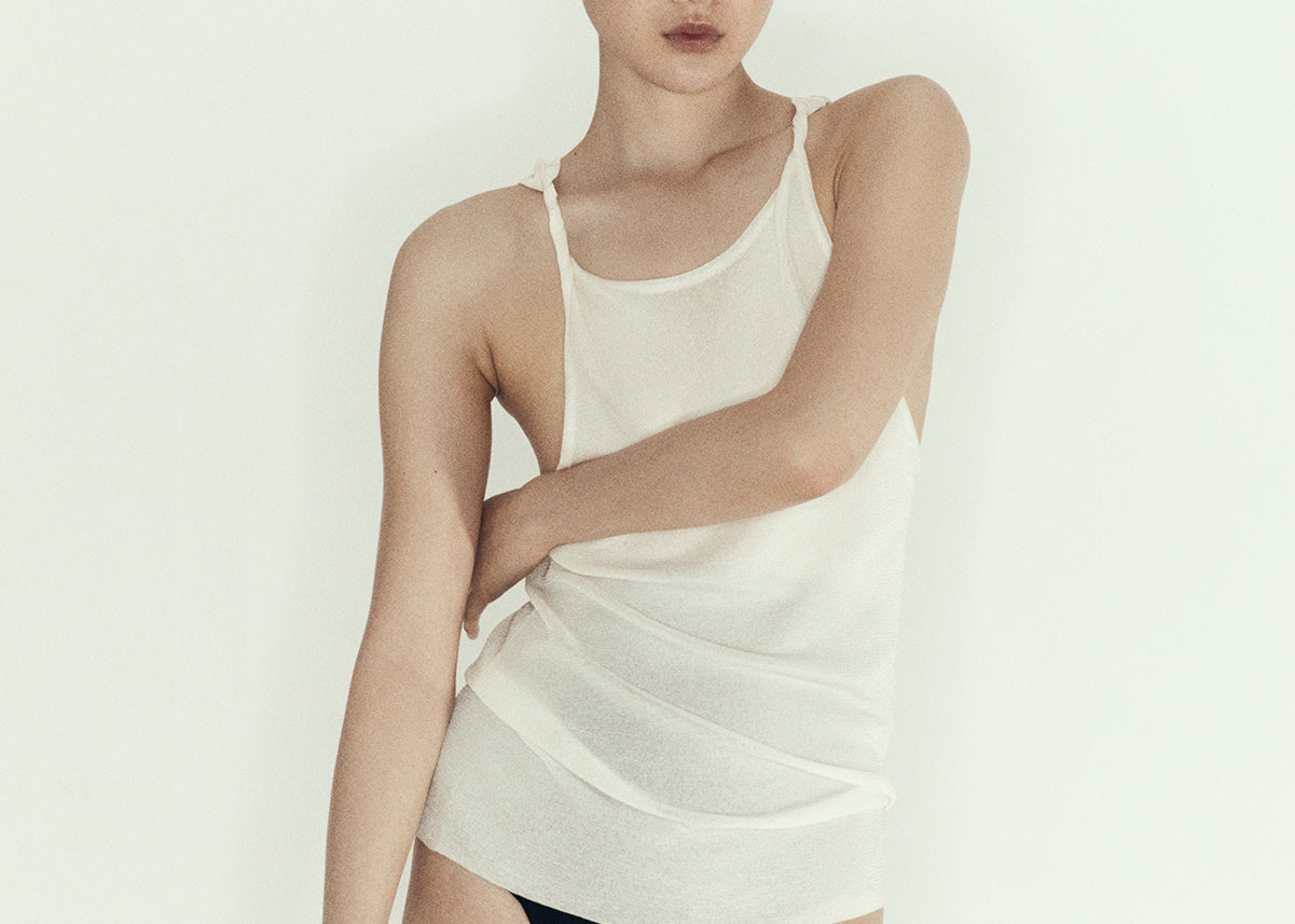 model wearing sener besim twisted singlet in ecru relaxed fit 