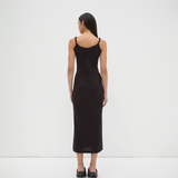 twisted strap singlet slip dress back view on model in black by sener besim