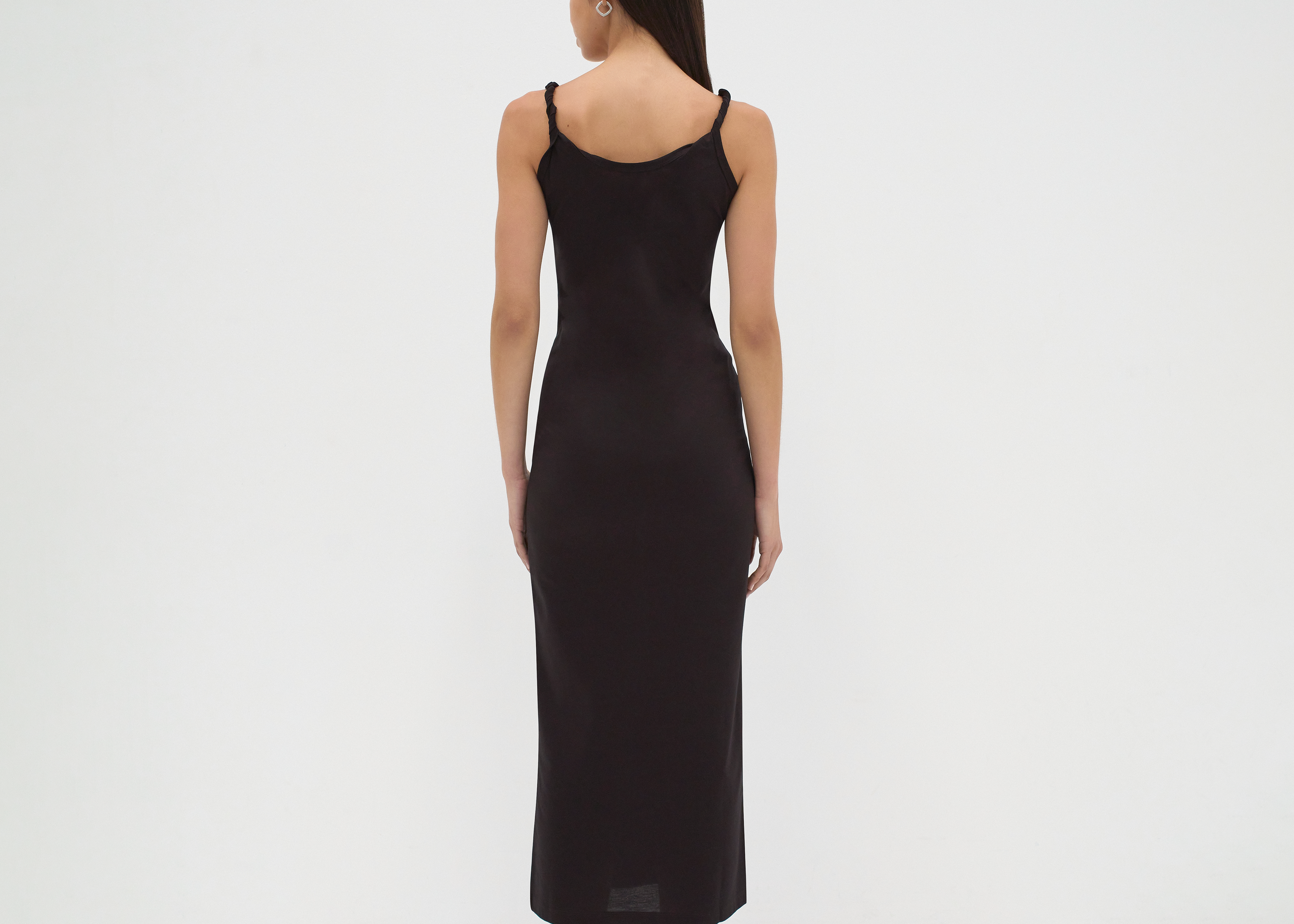 twisted strap singlet slip dress back view on model in black by sener besim