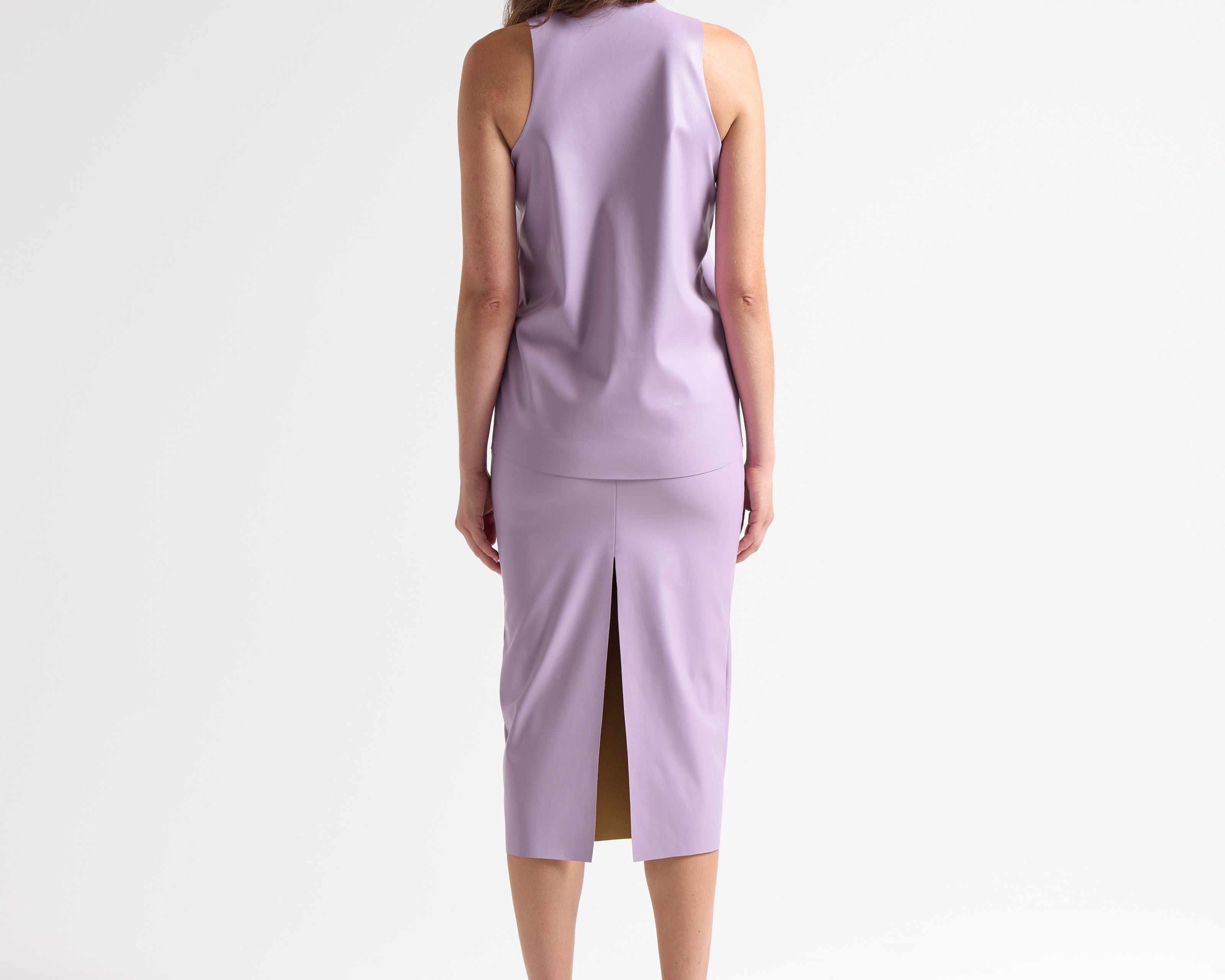leather sleeveless top on model back view by sener besim