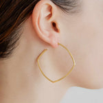 large earring on model square shape by sener besim