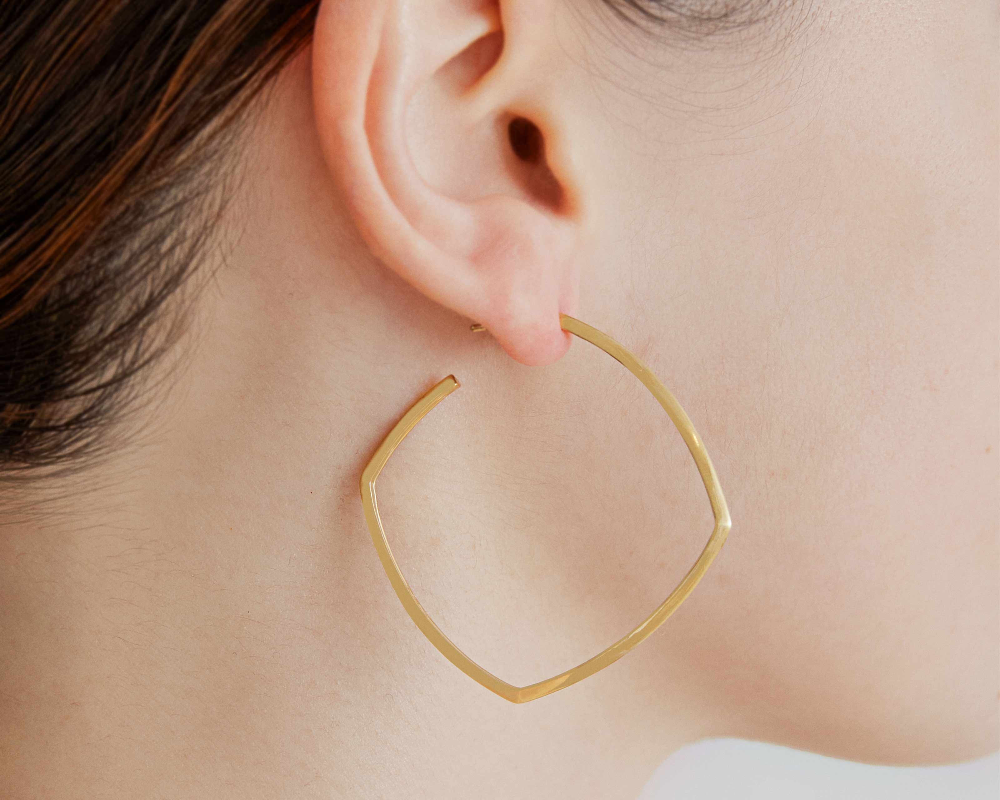 large earring on model square shape by sener besim
