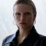 model wearing large spike hoops statement jewellery by sener besim