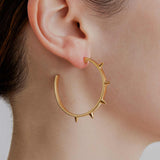 gold hoop earrings large with spike point detailed by sener besim