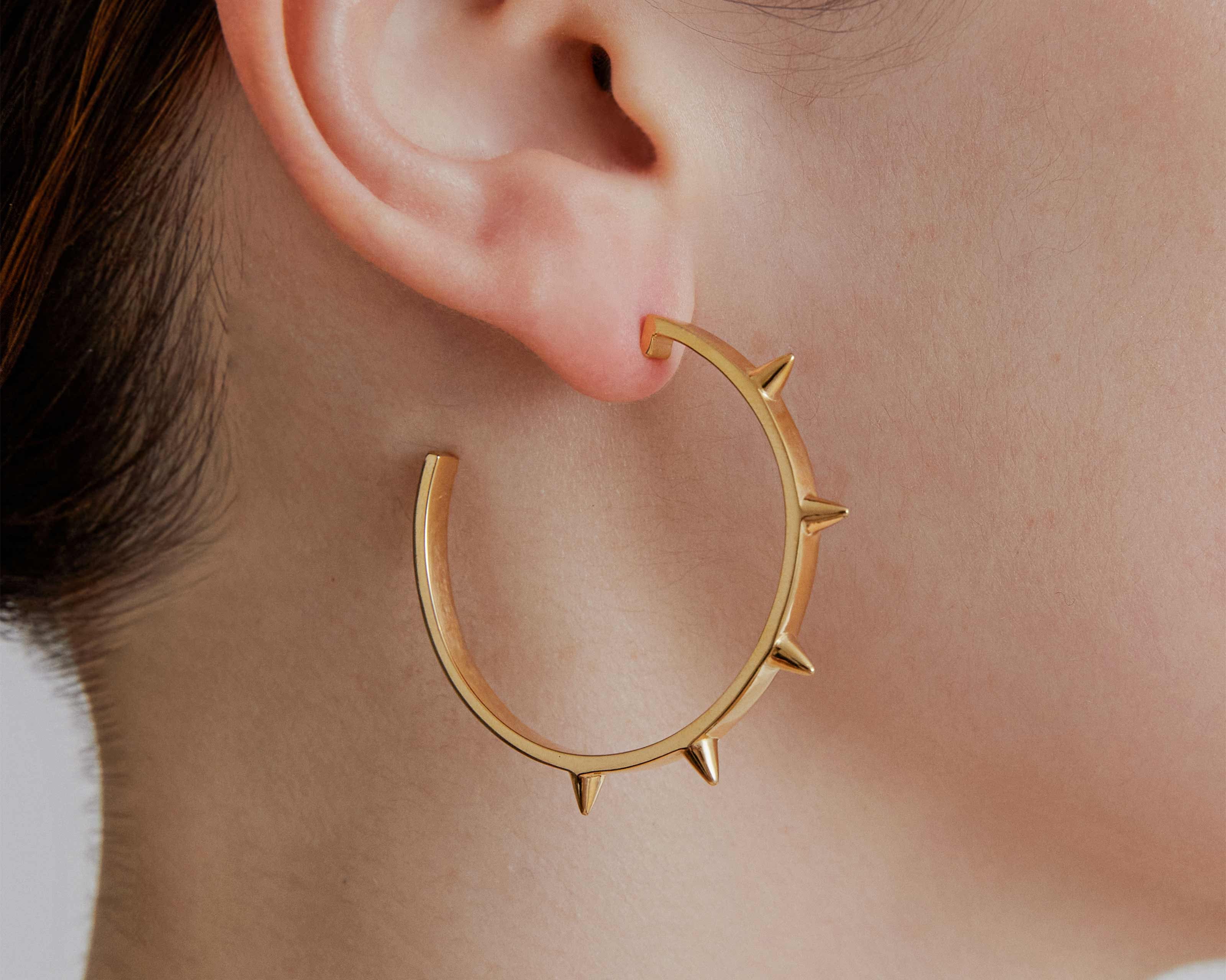 gold hoop earrings large with spike point detailed by sener besim
