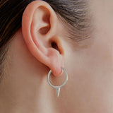 sener-besim-large-single-point-huggie-silver-earrings