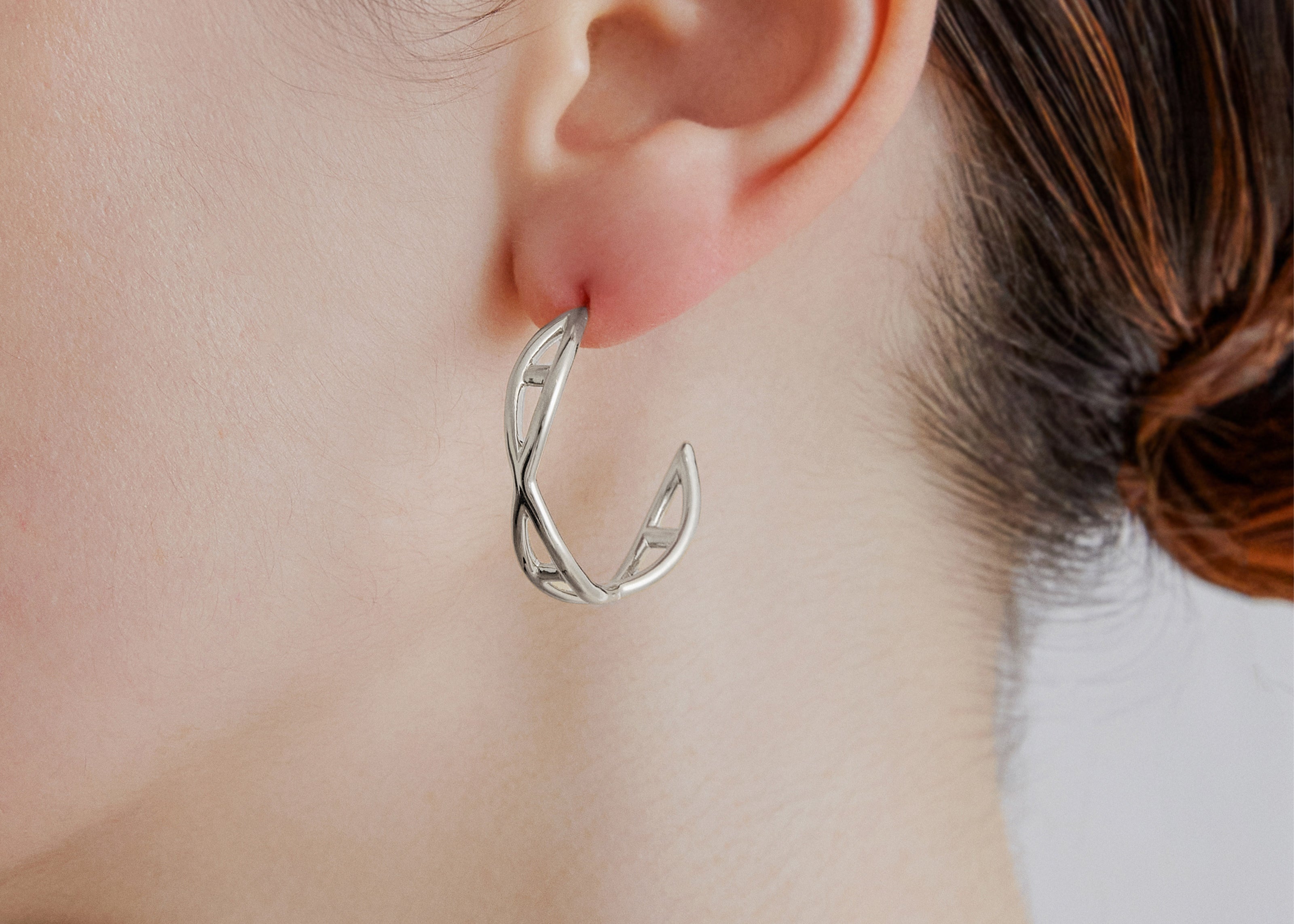 Şener Besim Medium Helix Hoops silver worn on ear, sculptural helix design, rhodium plating