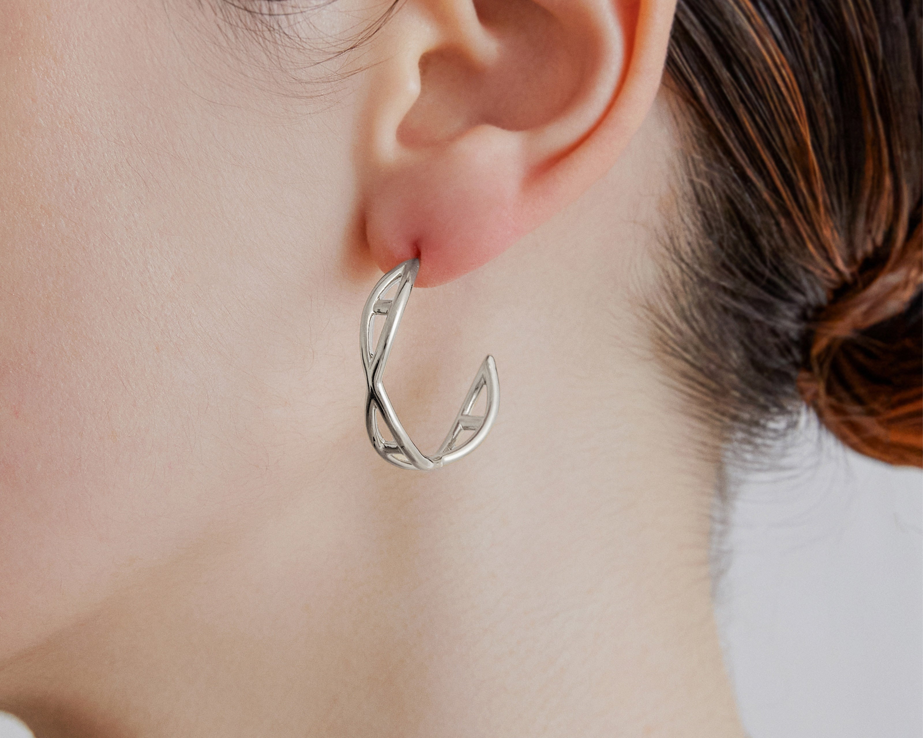 Şener Besim Medium Helix Hoops silver worn on ear, sculptural helix design, rhodium plating
