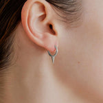 Şener Besim Medium Single Point Huggies in silver rhodium plating, worn on ear