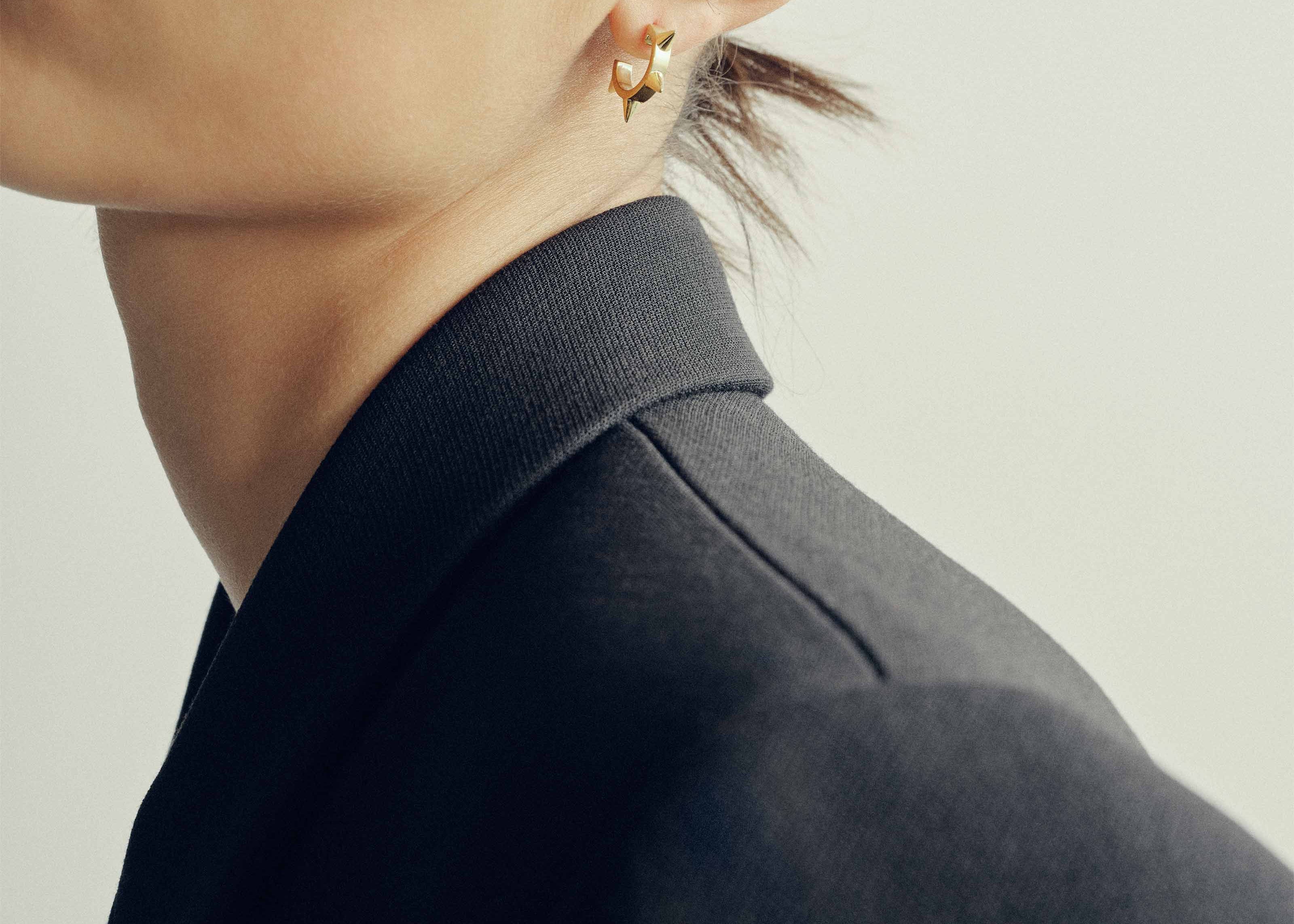 Şener Besim Multipoint Ear Cuff gold worn on ear, Spike Series, editorial shot