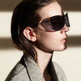 Şener Besim S1 sunglasses in nero and graphite worn, handcrafted titanium frame