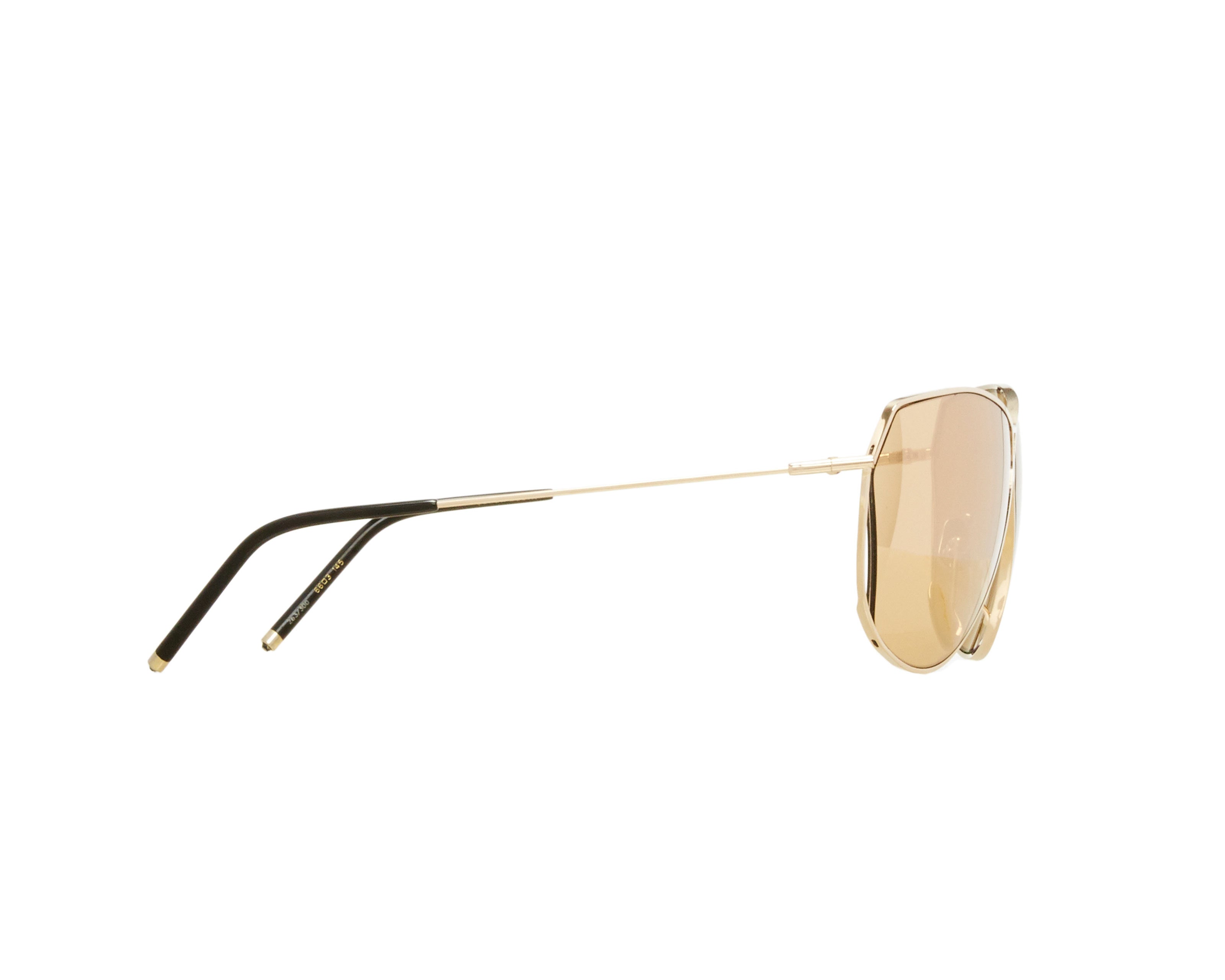 Şener Besim S2 sunglasses in aurous gold, aviation grade titanium frame, side lay