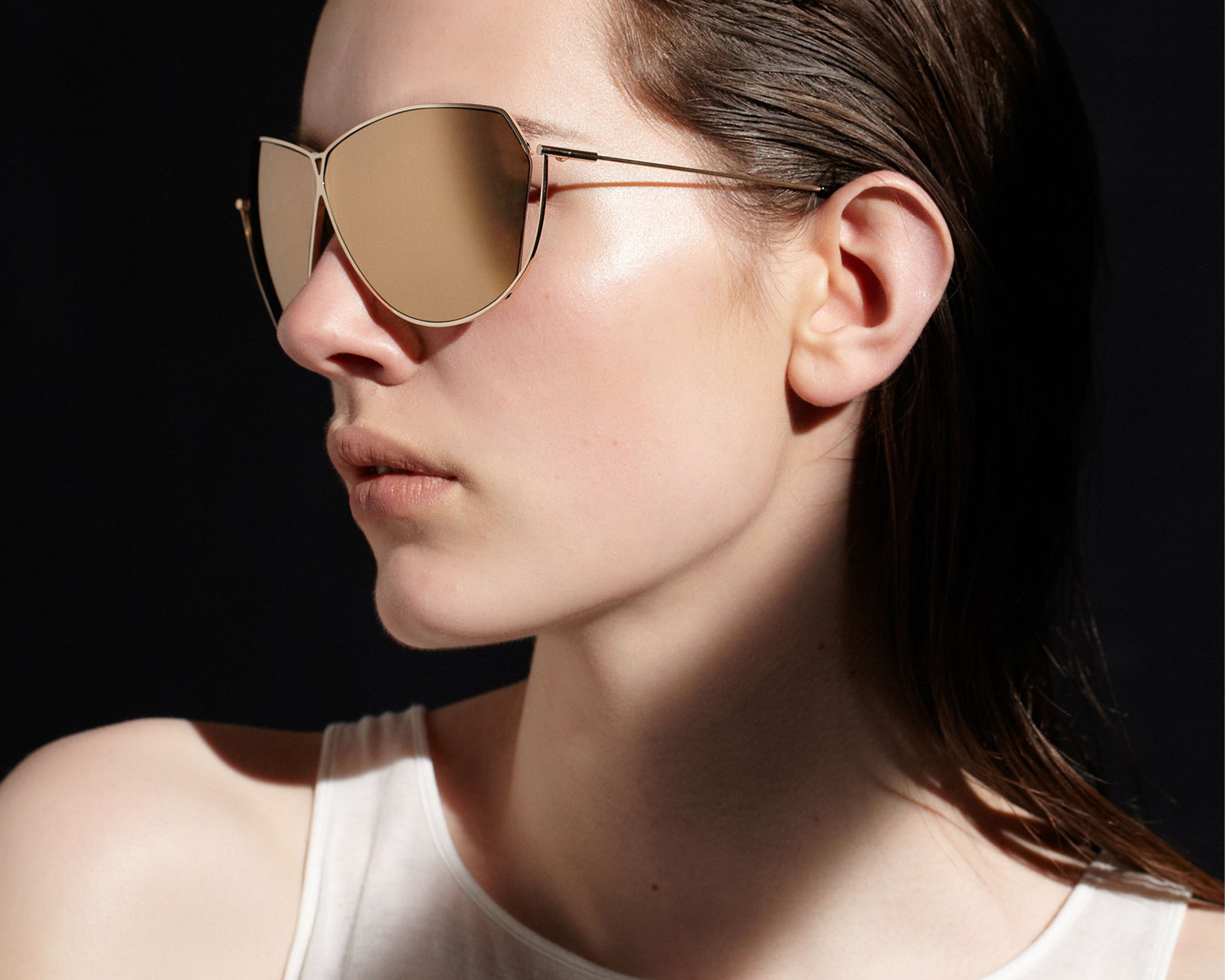Şener Besim S2 sunglasses in aurous gold, aviation grade titanium frame, worn model