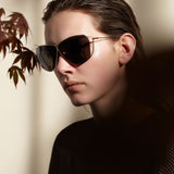 Şener Besim S2 sunglasses aurous graphite worn, titanium frame, side profile