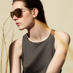 Şener Besim S2 sunglasses nero gold worn, titanium frame, editorial shot
