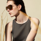 Şener Besim S2 sunglasses nero gold worn, titanium frame, editorial shot