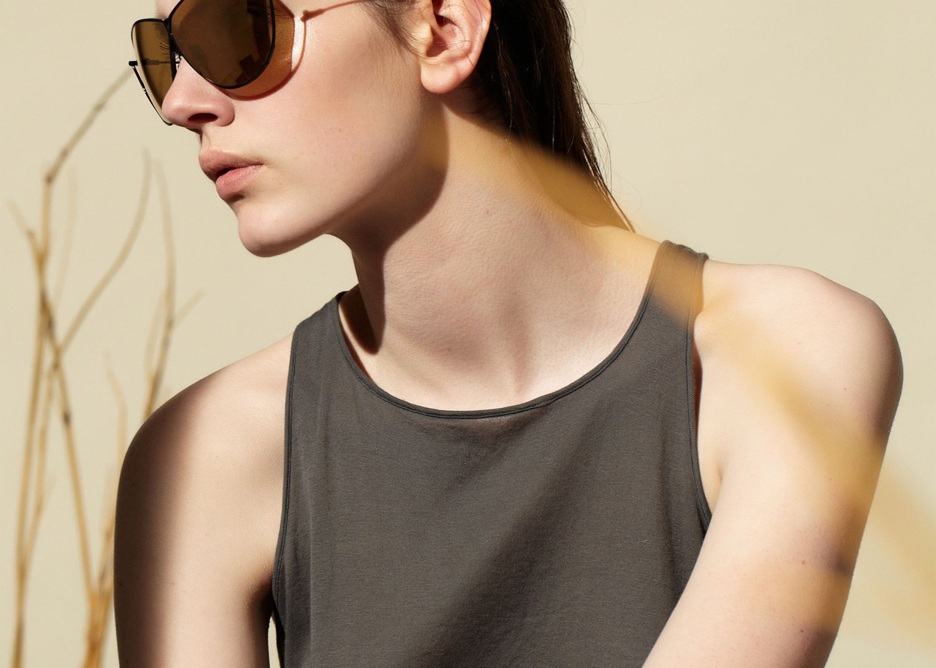 Şener Besim S2 sunglasses nero gold worn, titanium frame, editorial shot