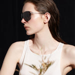 Şener Besim S2 sunglasses in nero graphite, aviation grade titanium frame, lifestyle shot