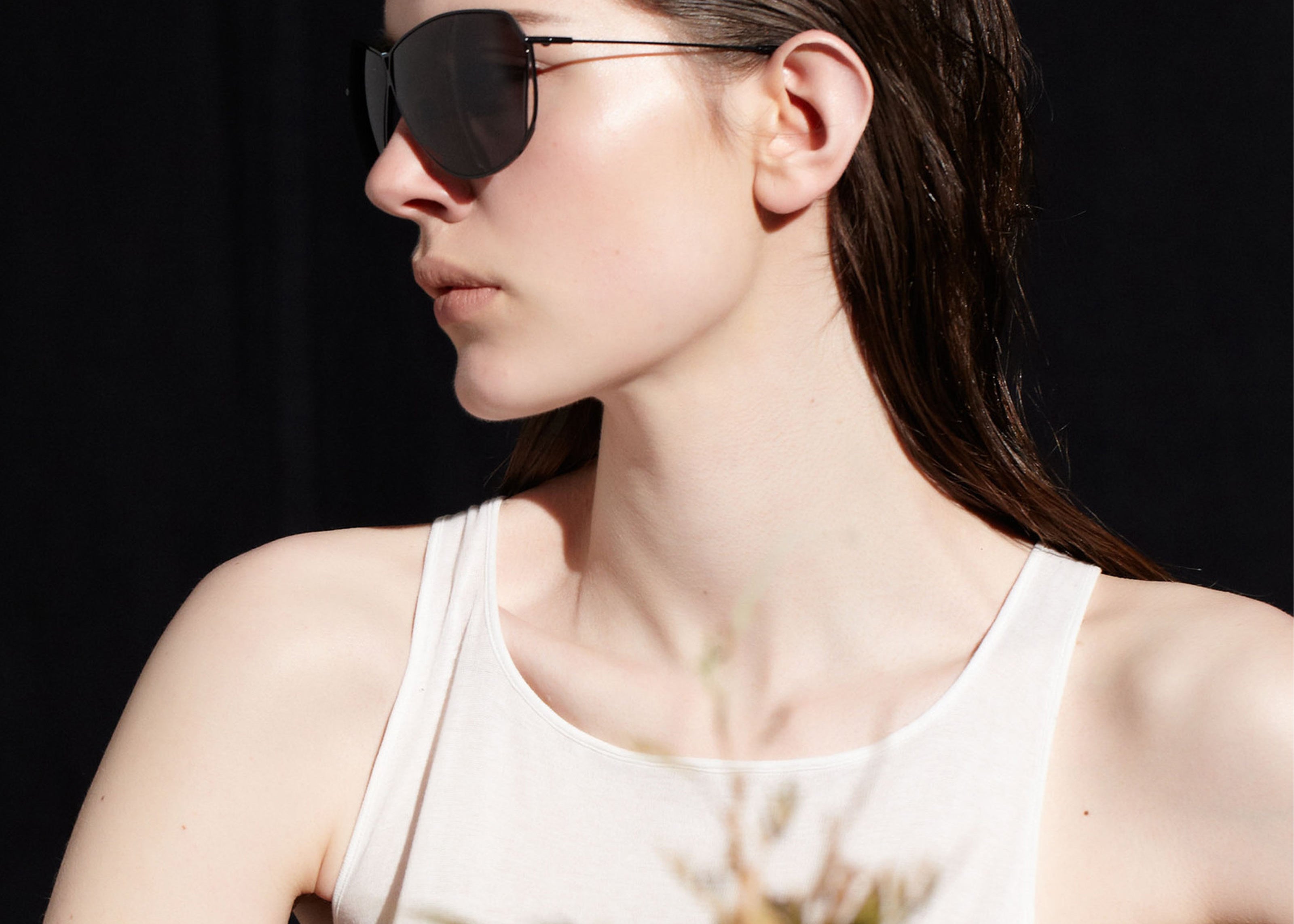 Şener Besim S2 sunglasses in nero graphite, aviation grade titanium frame, lifestyle shot