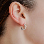 Şener Besim Small Helix Hoops silver, sculptural helix hoop detail close up